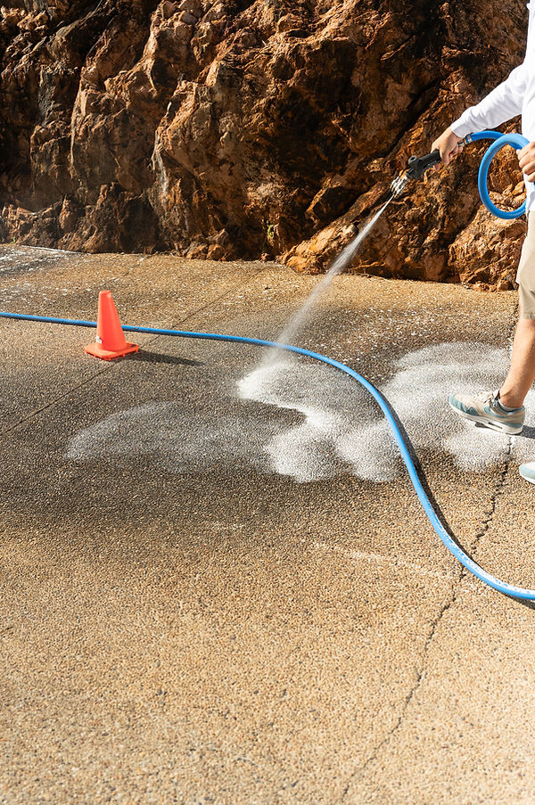 Exposed aggregate driveway cleaning at 1 Little Street, Belgian Gardens QLD 4810.