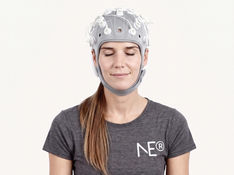Person in yoga pose with EEG brain wave overlay illustrating neural activity during yoga practice