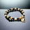 Thumbnail: Yin-Yang charm bracelet with gold hematite, moonstone and black onyx 