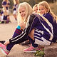 Portrait of Happy Girls Tying Shoes