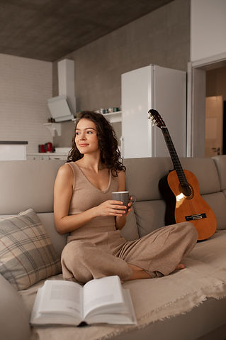 woman-digital-disconnecting-home-by-reading-book.jpg