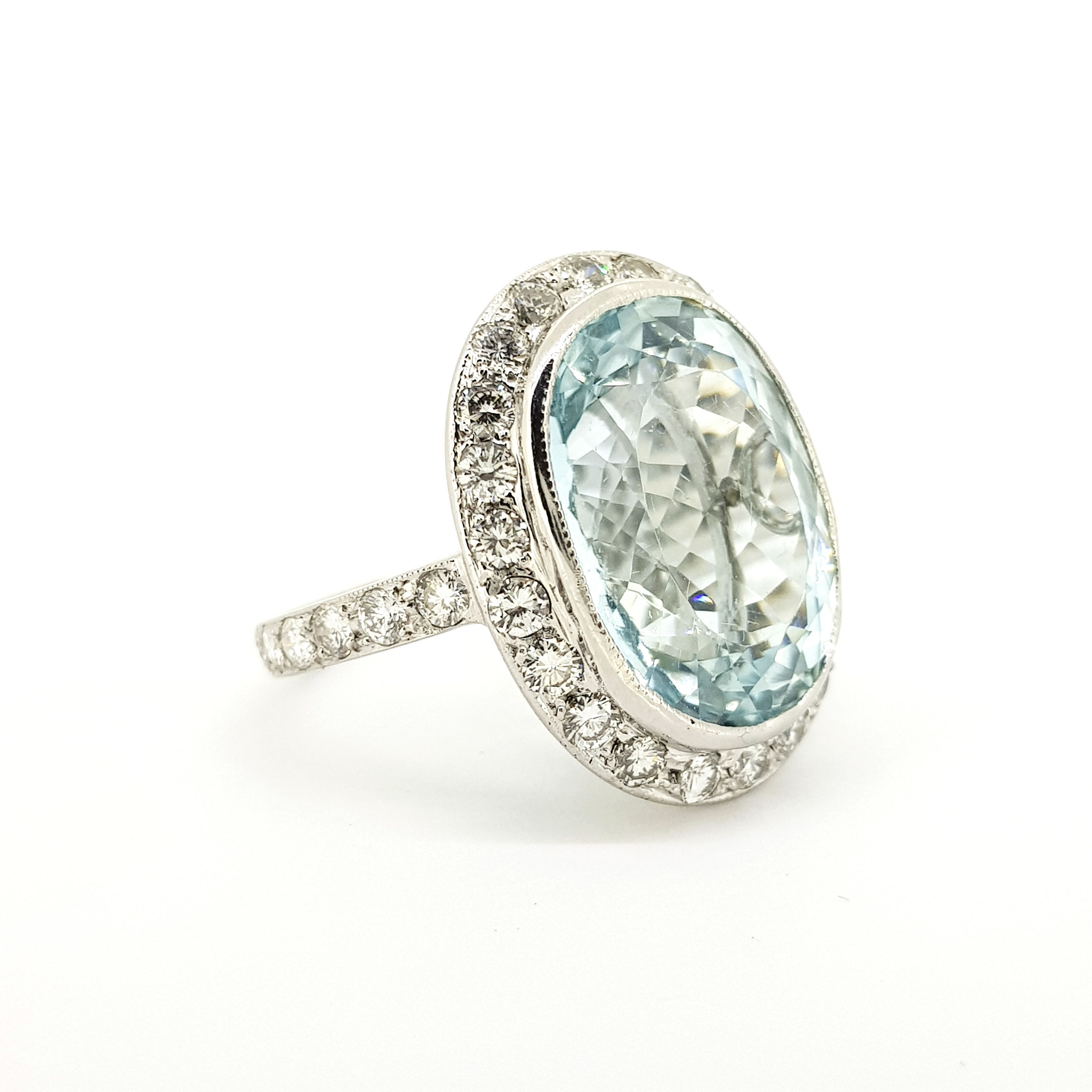 Aquamarine and diamond cluster ring. A22cts Est
