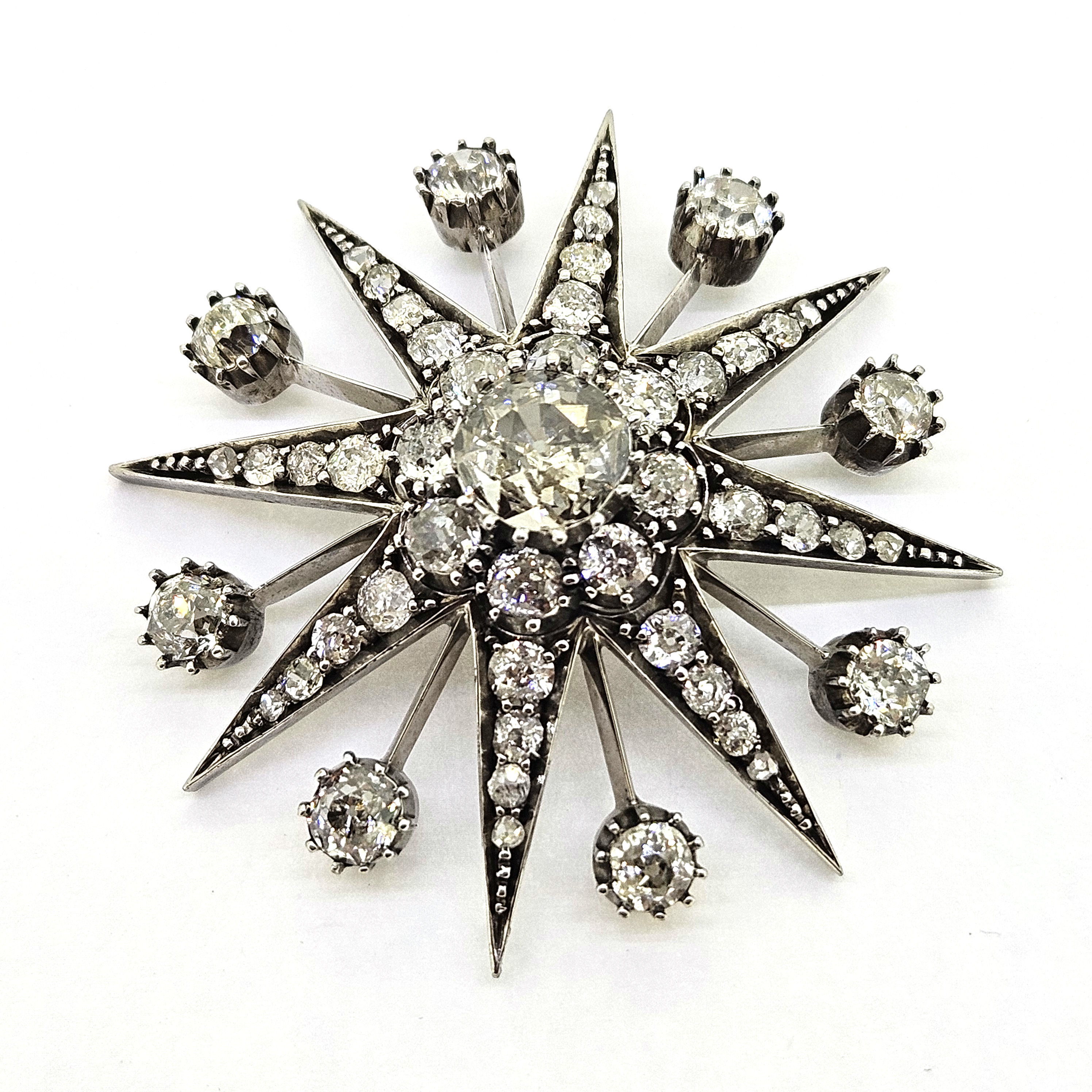 Old cut diamond star brooch