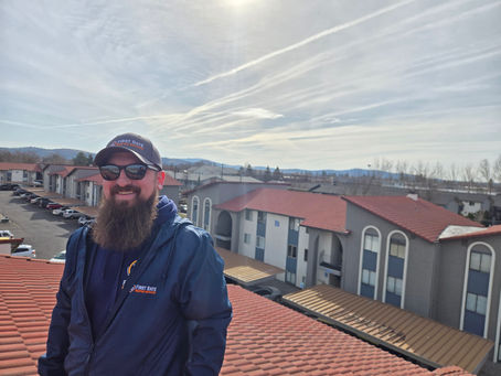 First Rate Roofing team member on a roof