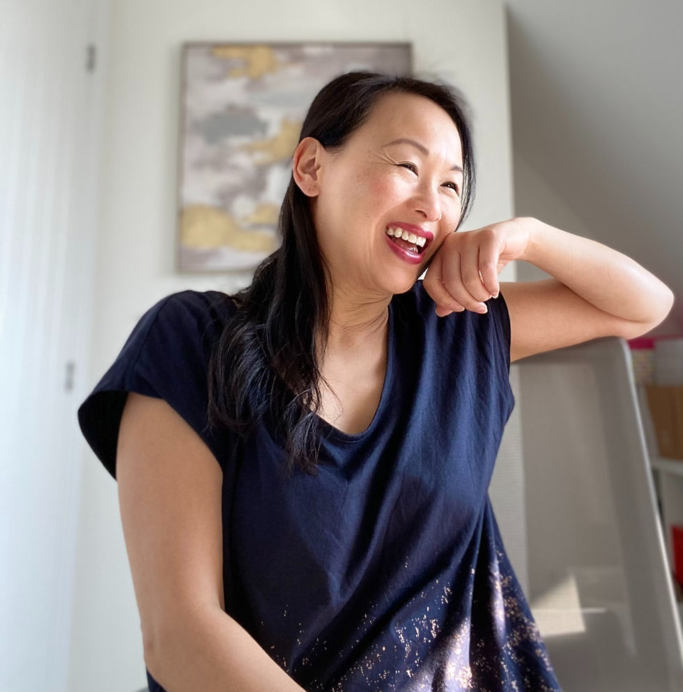 Kitty Lai sitting in office at ME BRAND and laughing in meeting chat