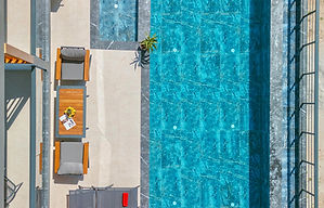 Luxury concrete swimming pool in St. George Utah backyard by Bright Construction Solutions