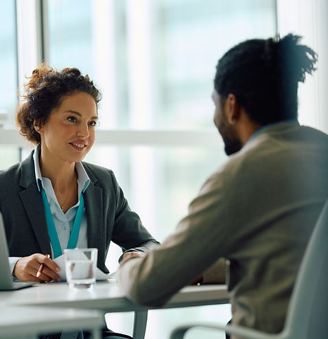 Human resource manager communicating with African American candidate during job interview