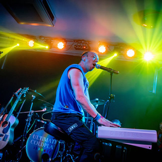 Ultimate Coldplay tribute band lead singer playing the piano live on stage at The Northcourt LIVE Abingdon.