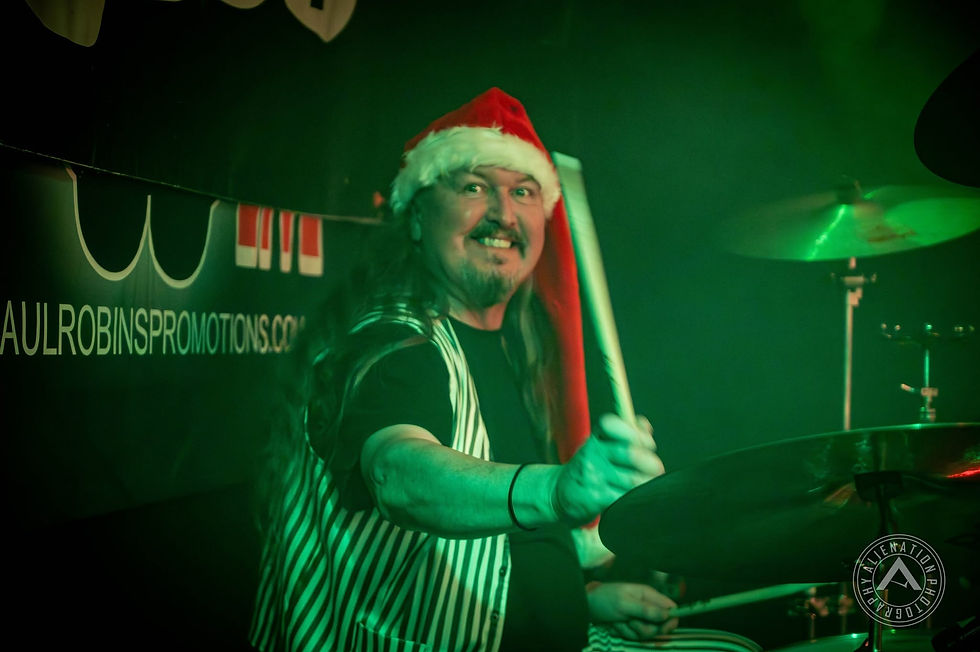 Slade UK drummer performing in a Santa hat at The Northcourt LIVE in Abingdon. Photo by Alienation Photography.