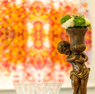 This pink-and-lime green buffet setting includes a cherub centerpiece, platters, bowls, service ware, plates, and glassware for up to 20 people. Perfect for a spring or summer celebration!