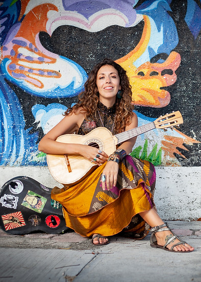 Music Instructor sitting with instrument