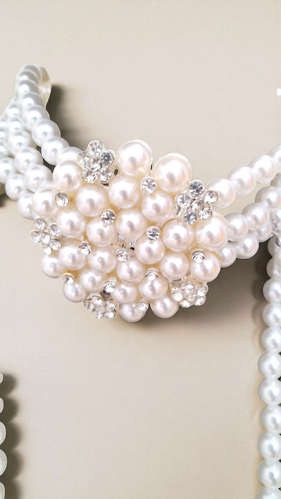 Thumbnail: The Ashanti Pearls is dazzling. A rhinestone encrusted broach choker pearl necklace with matching bracelet and earrings.