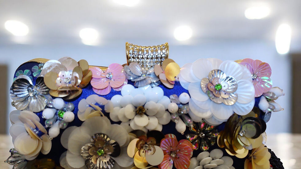 Discover elegance with The Lydia Satin Appliqued Clutch from With Love, The Gift Shop. This stunning clutch, adorned with bea