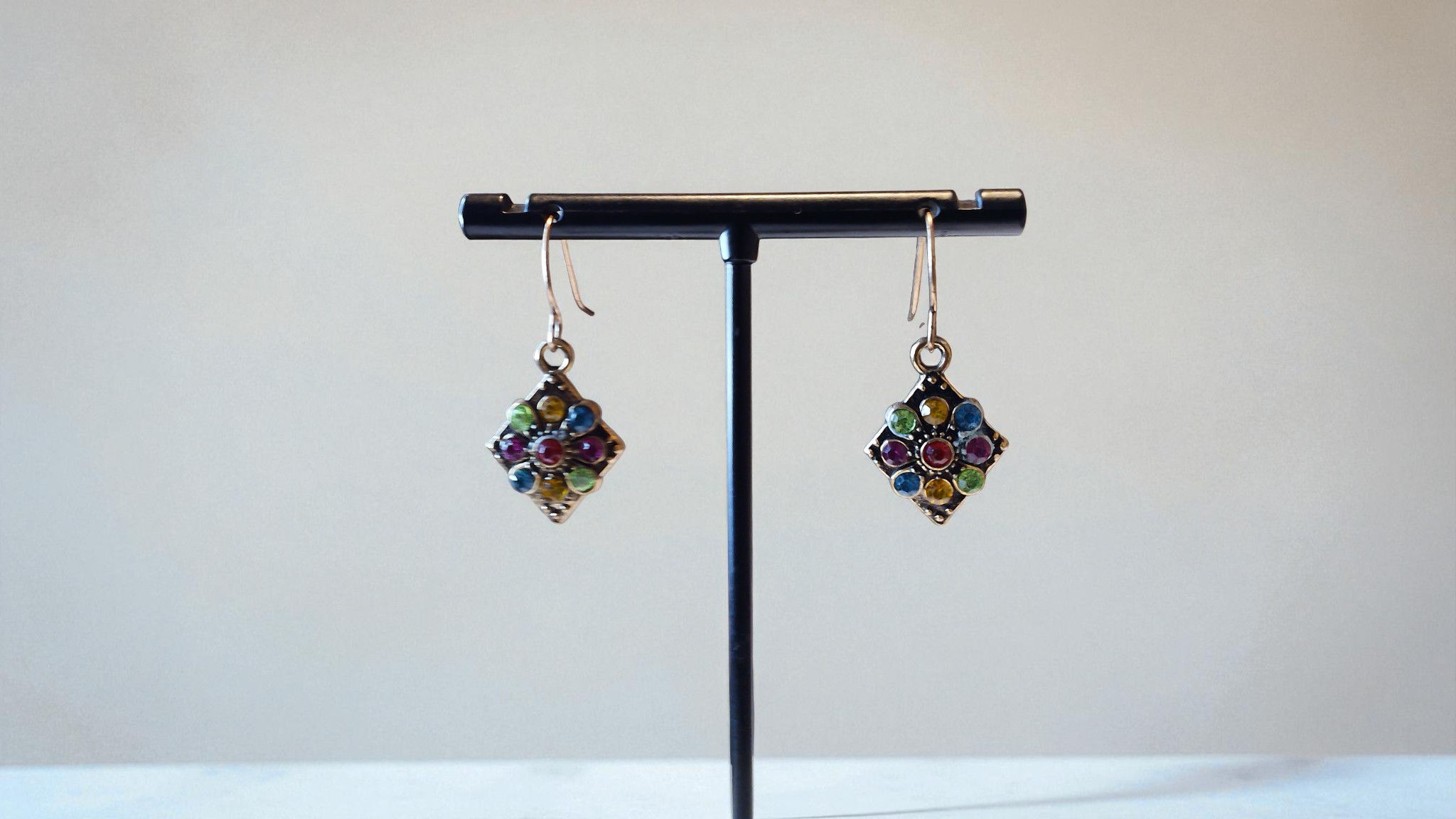 Elevate any occasion with The Lea Bejeweled Earrings from With Love, The Gift Shop. This colorful, diamond-shaped pair is the