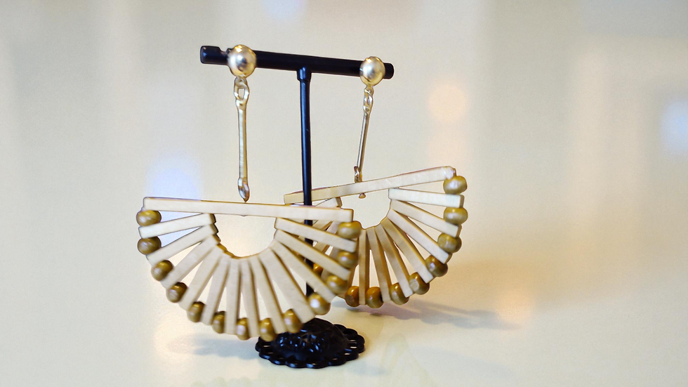 Thumbnail: Discover The Bianca Bamboo Earrings at With Love, The Gift Shop. These unique bamboo earrings, featuring a gold tone bar and