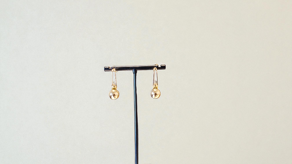 Discover The Leelee Earrings, blending elegance and uniqueness with gold-toned anchor and hook elements