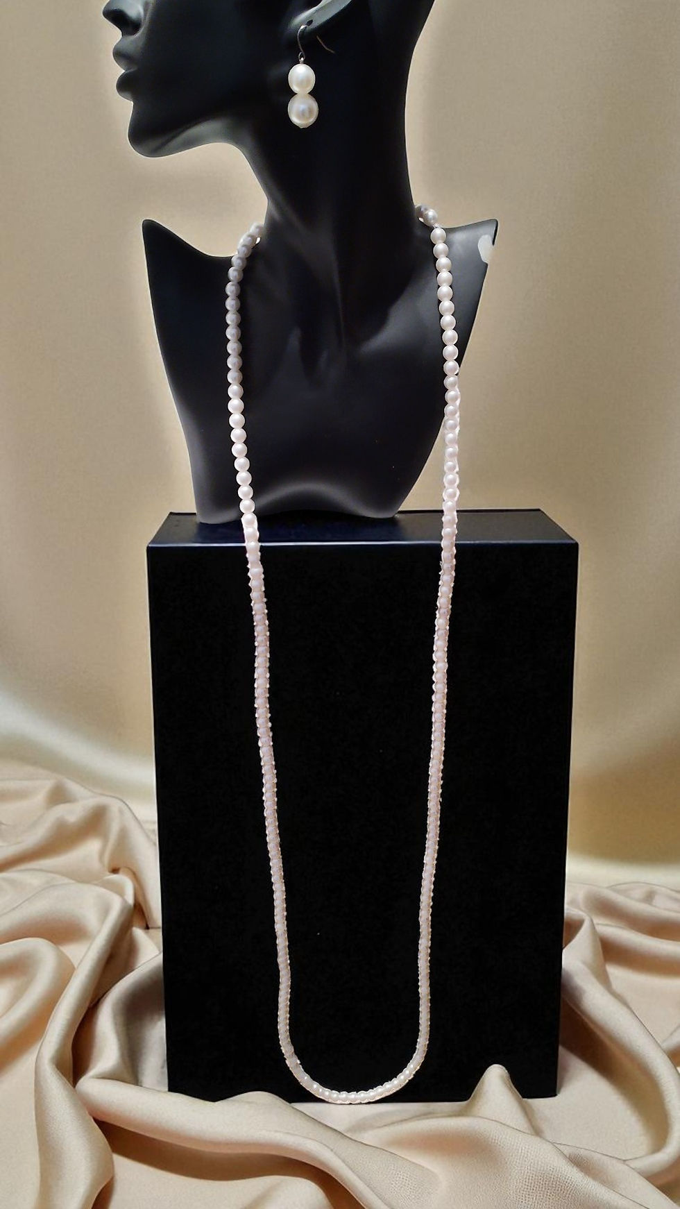 Thumbnail: The Ava Pearls: a versatile, single strand of medium-sized pearls that transforms into two or three strands.