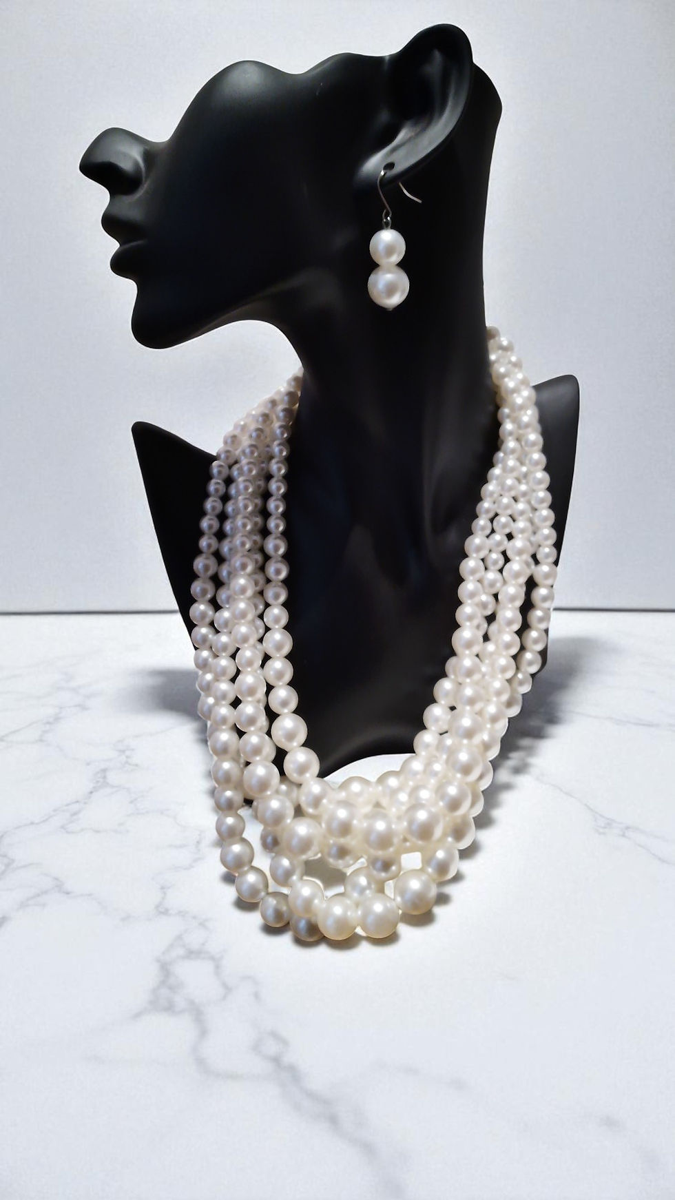 Thumbnail: The Amaya Pearls, with five strands and matching earrings, embody elegance and timeless beauty.