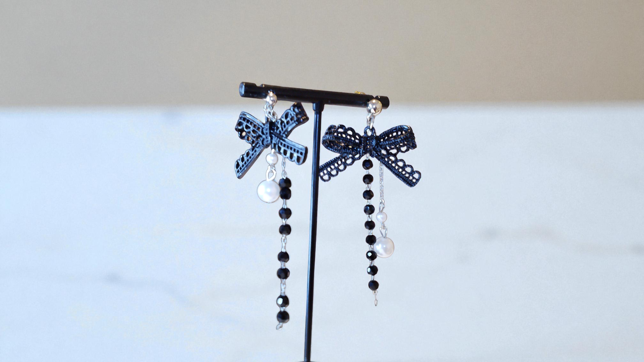 Enhance any outfit with The Pamela Bow Earrings from With Love, The Gift Shop. These drop-dangle earrings feature a black and