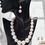Thumbnail: a strand of pearls with matching earrings