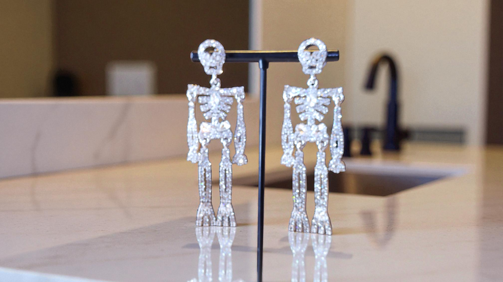 Discover our blinged-out skeleton earrings, perfect for Halloween, parties, or making a bold statement. At With Love, The Gif