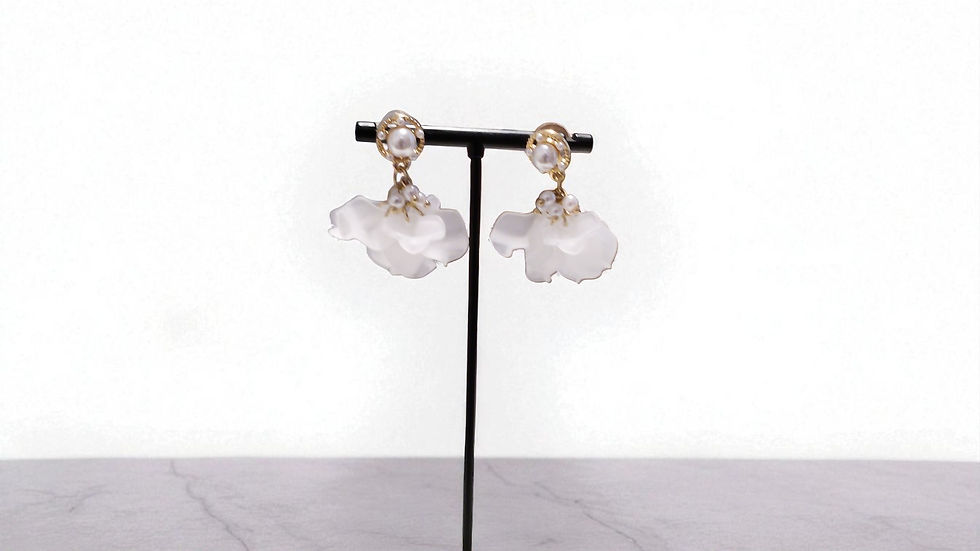 Thumbnail: Discover The Floral Bud Earrings at With Love . These gold-toned hoops with pearl tips are perfect for any special occasion.