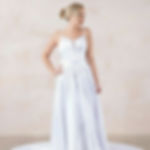 Audrey is a stunning satin wedding dress blending elegance and modern design, featuring a plunge back and sheer tulle sides