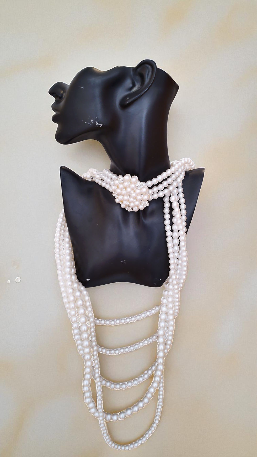 Thumbnail: The Ashanti Pearls is dazzling. A rhinestone encrusted broach choker pearl necklace with matching bracelet and earrings.