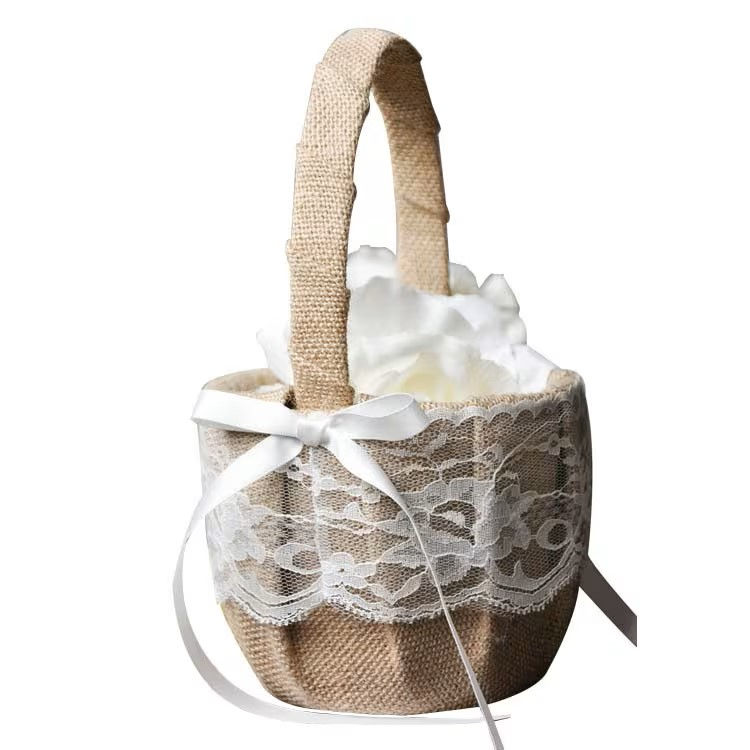 A flower girl basket made with natural linen an finished with lace trim.