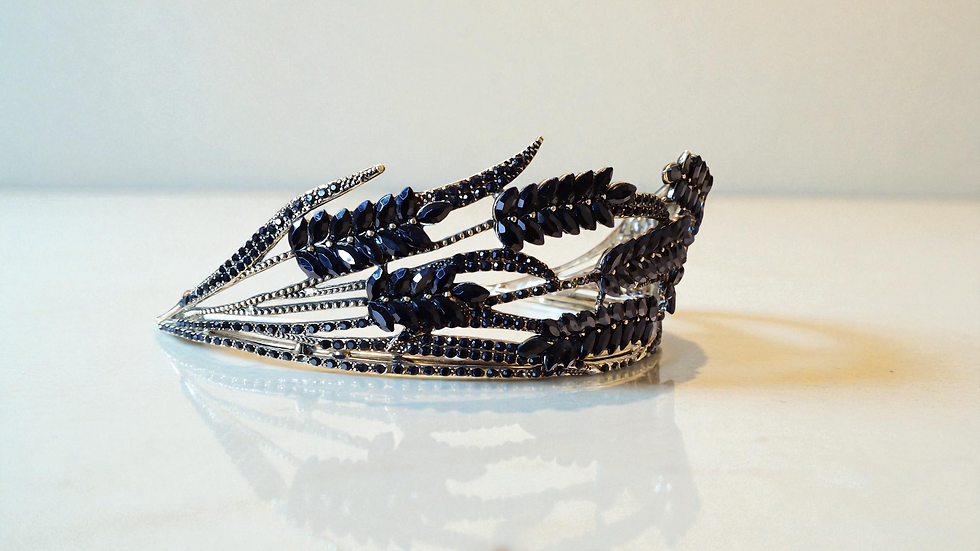 Thumbnail: Elegance meets sophistication in The Gracie Tiara, a gold-toned masterpiece with black leaf-shaped beading.