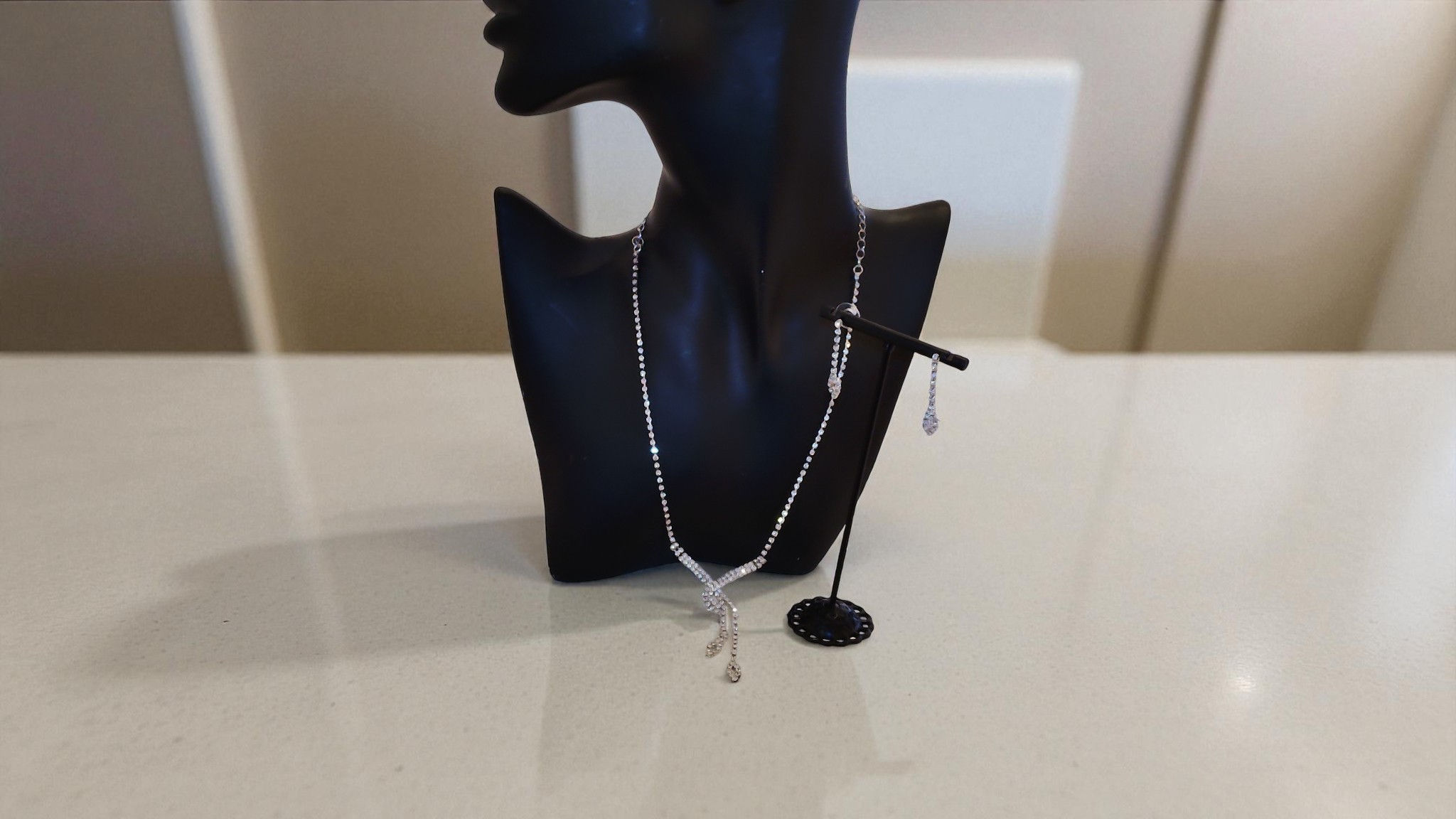 Enhance your elegance with The Sabrina Tear Drop Necklace Set from With Love, The Gift Shop. This rhinestone necklace with ea