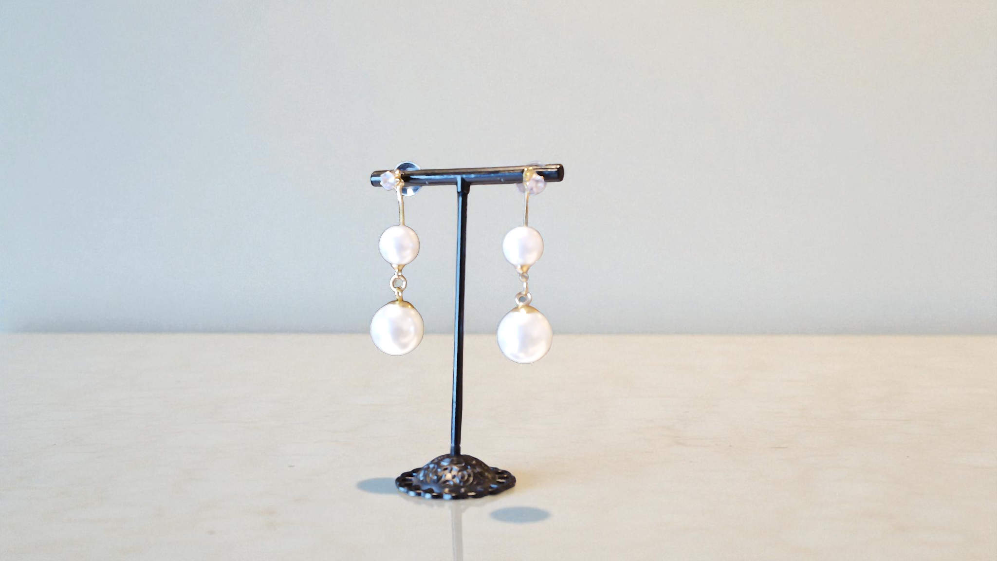 Enhance your moments with The Ola Pearl Earrings. Ideal for brides, these double pearls with rhinestone bases are perfect gif