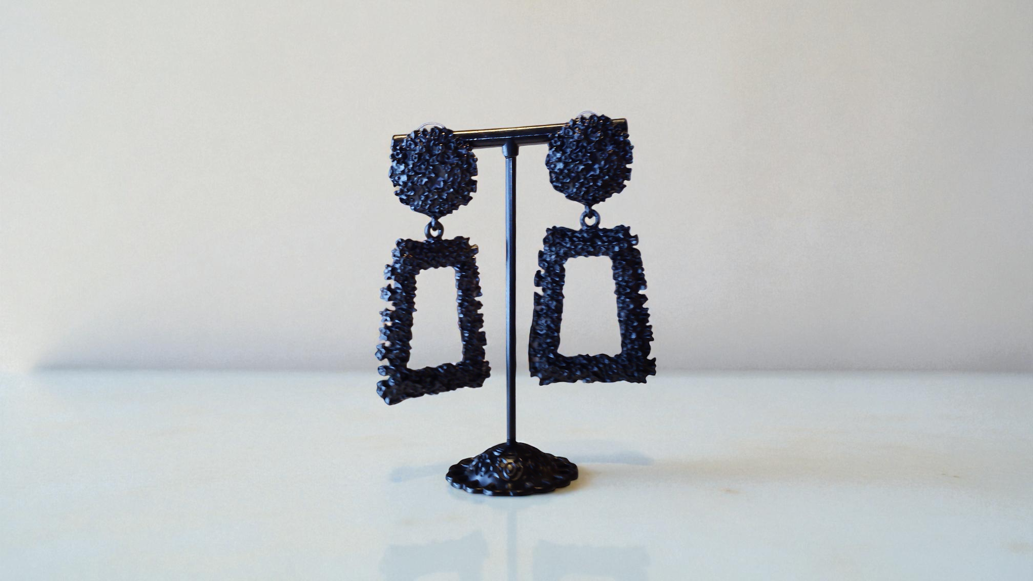 Available in black, silver, and rose gold, these nugget-style earrings are fun, radiant, and versatile. At With Love, The Gif
