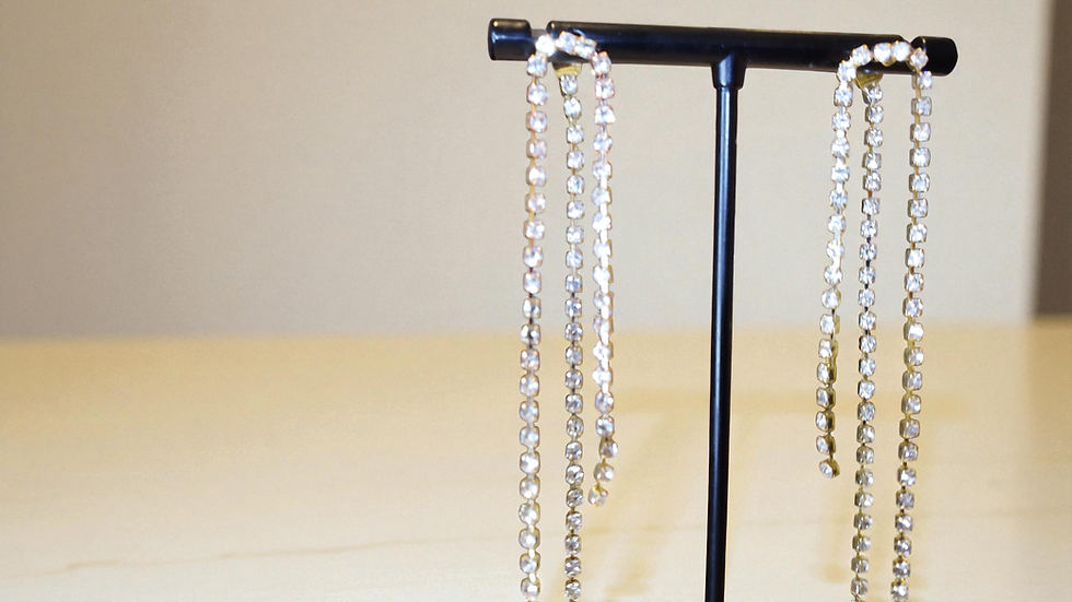 Thumbnail: Elevate your style with The Dangling Rhinestone Earrings from With Love, The Gift Shop. These drop and dangle rhinestone earr