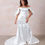 Thumbnail: Dahlia is an elegant off-white off-the-shoulder satin wedding gown designed for timeless beauty.