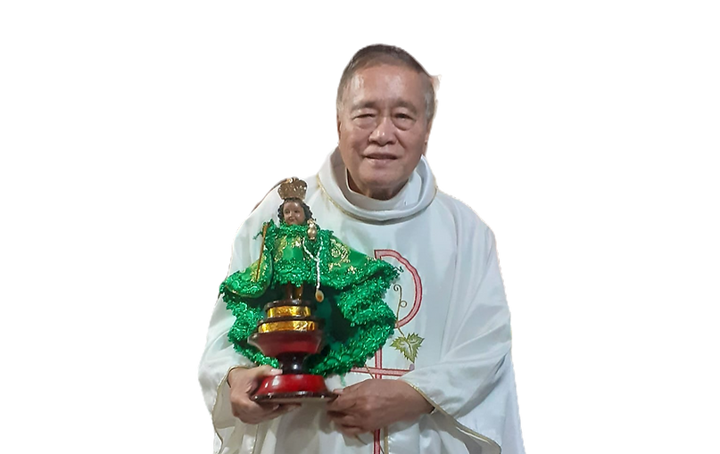 Msgr Burlaza with Sto Nino_edited.png