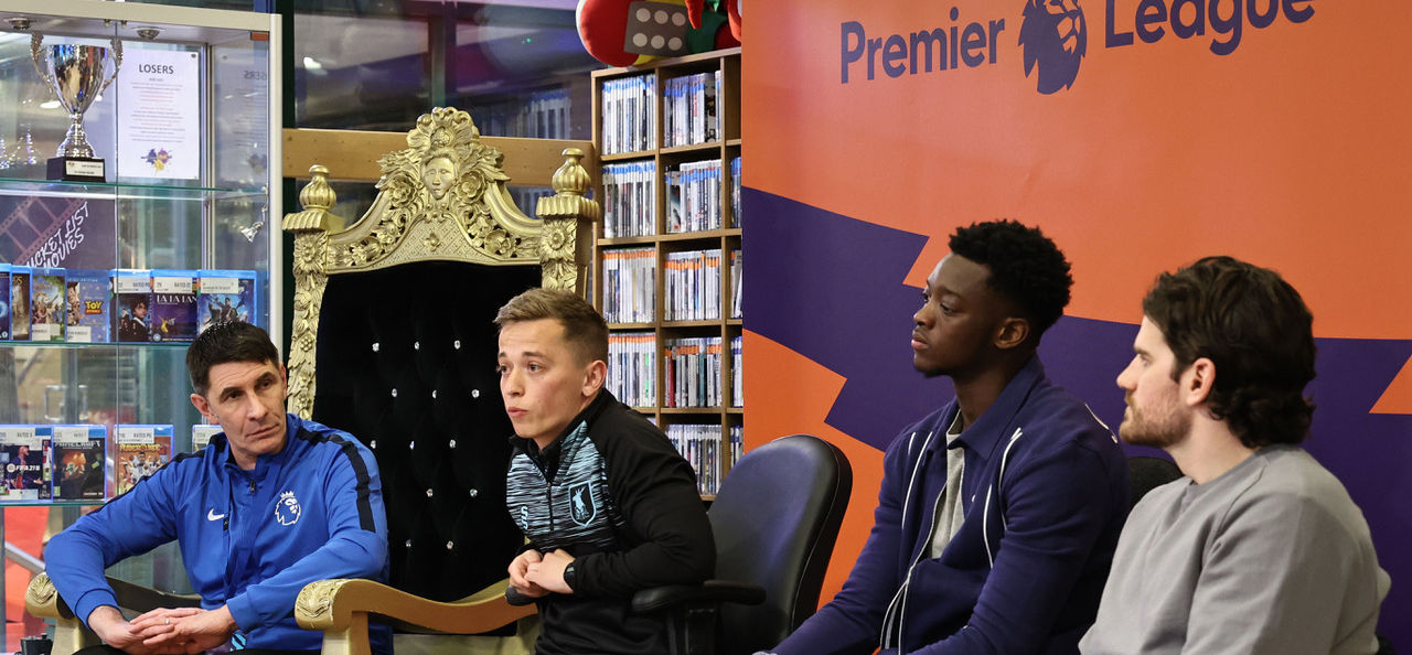 Premier League discussion panel with a coach on the right and three players on the left, Daniel Jinadu in the middle