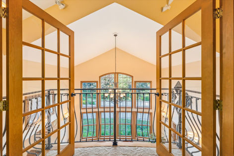Spacious home interior view with open French doors