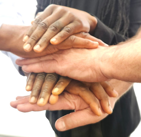 Three sets of hands stacked in alternating fashion