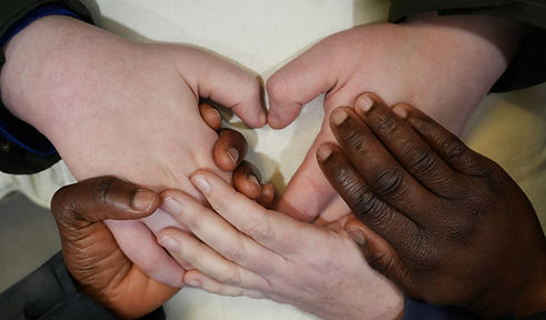 Images depicting three diverse sets of hands forming a heart, symbolizing community, teamwork, unity, and shared love.