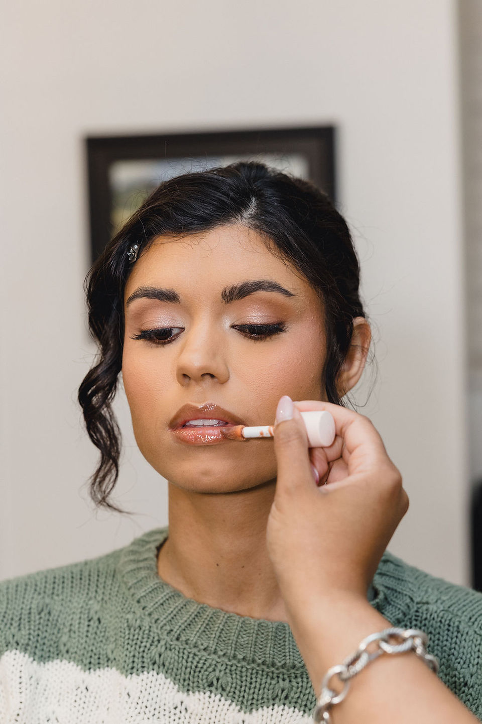 bride getting makeup done
