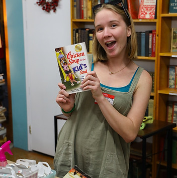 Riley finds a favorite read on volunteer night.