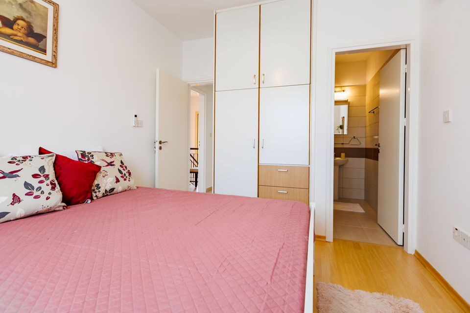 Bedroom with pink duvet