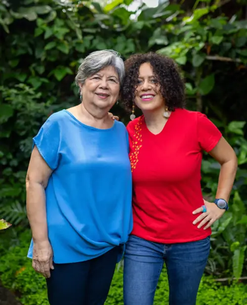 Guests enjoying gardens at an eco-friendly hotel in Antiguo Cuscatlán