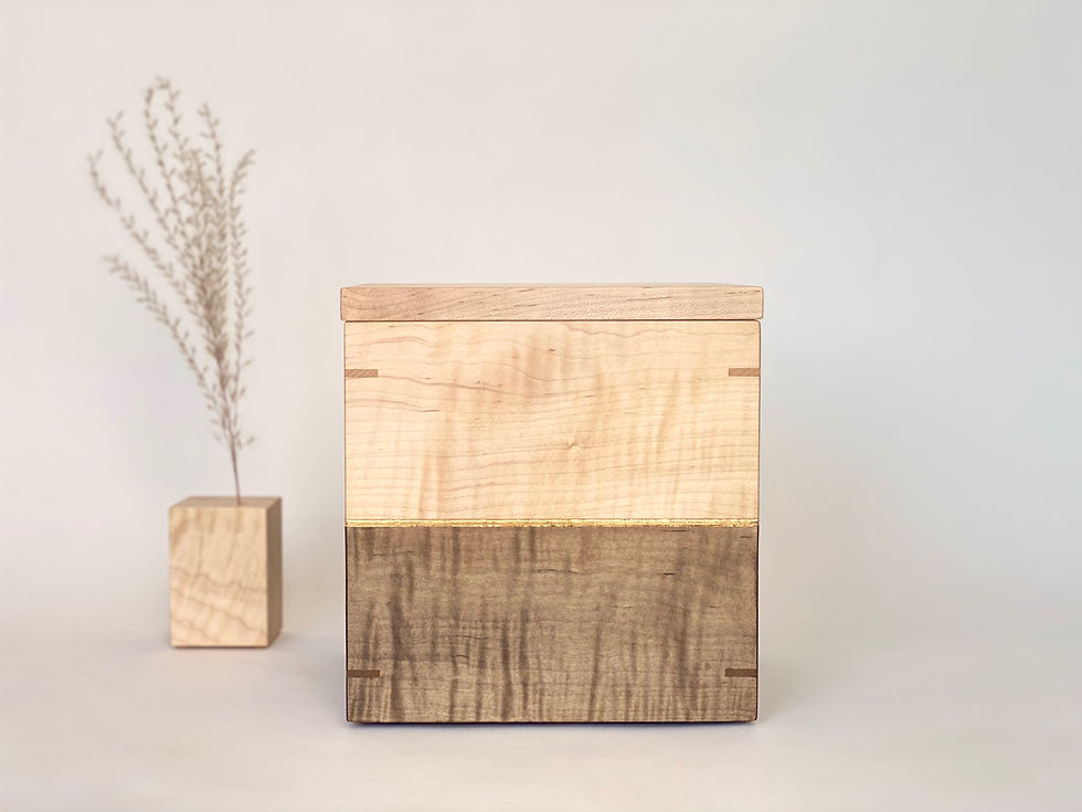 Front view of curly maple cremation urn with flower stand