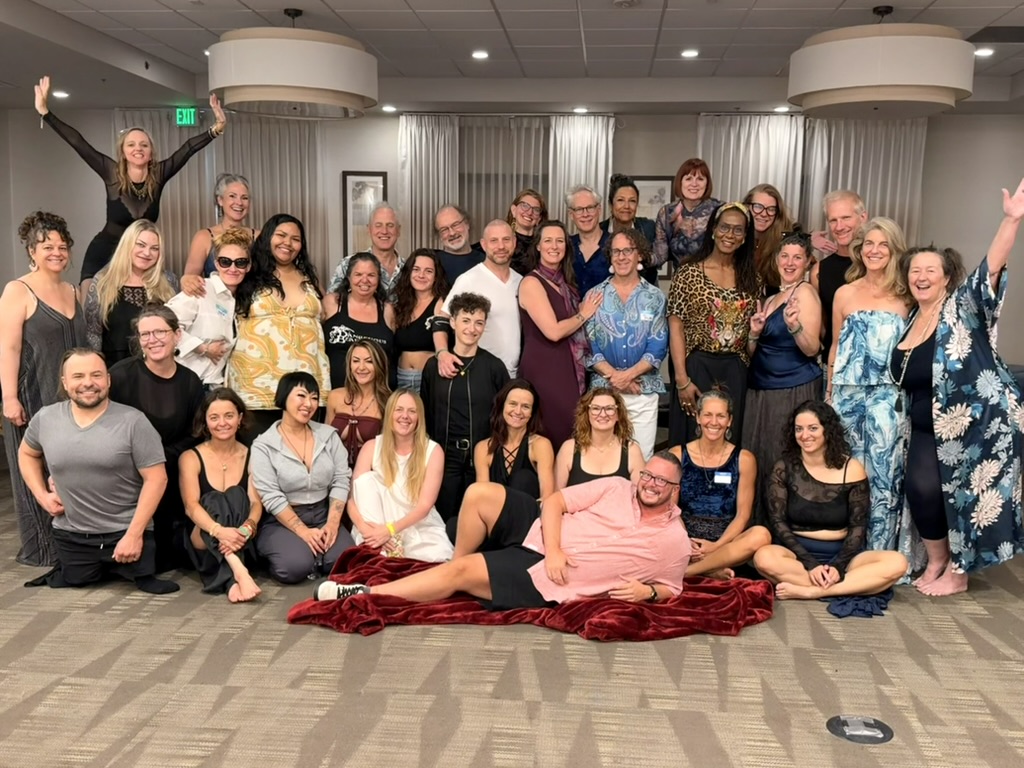 Guests smiling together in a group photo at Summer Bash 2025