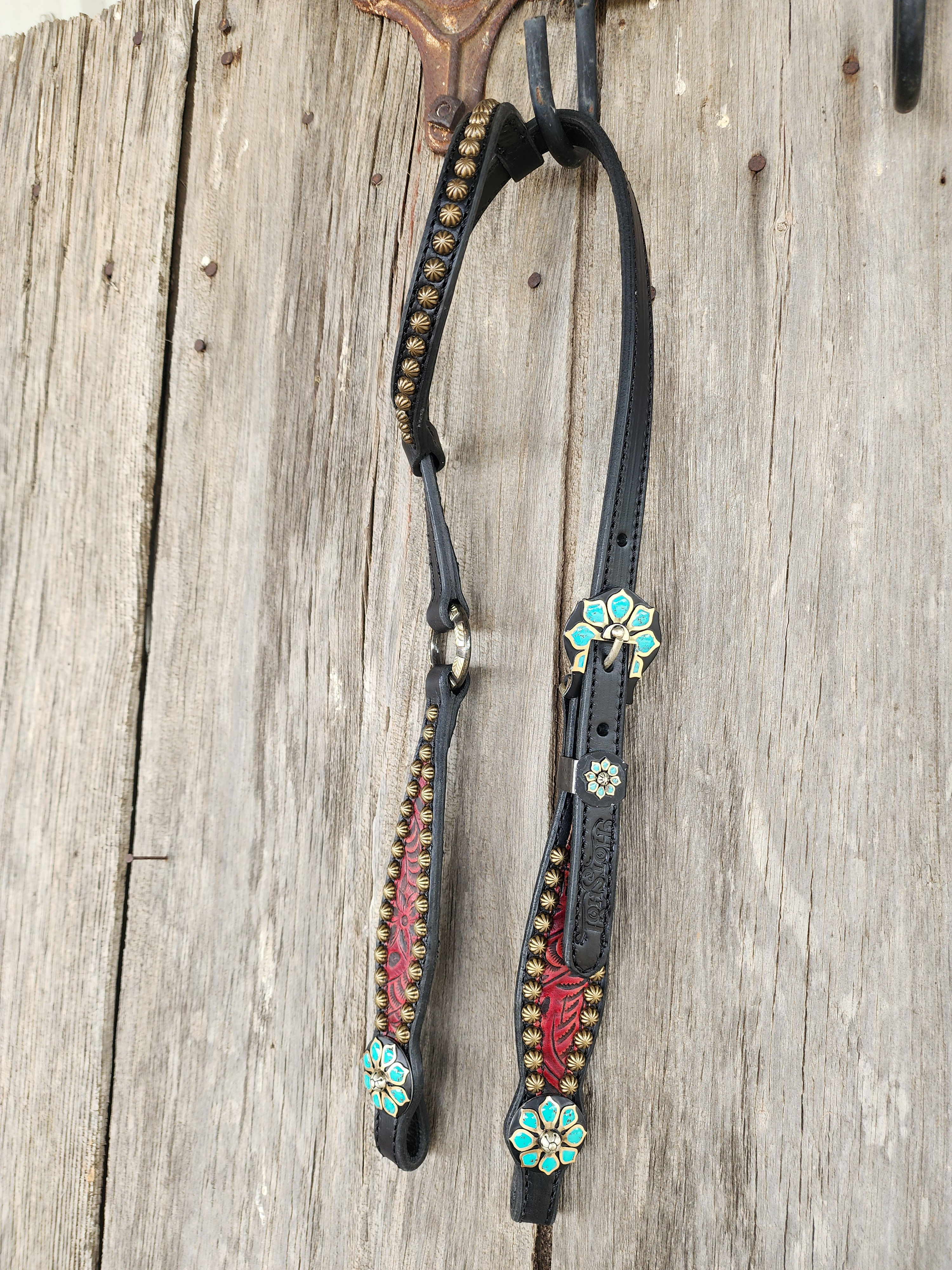 Black ring one ear with red overlay