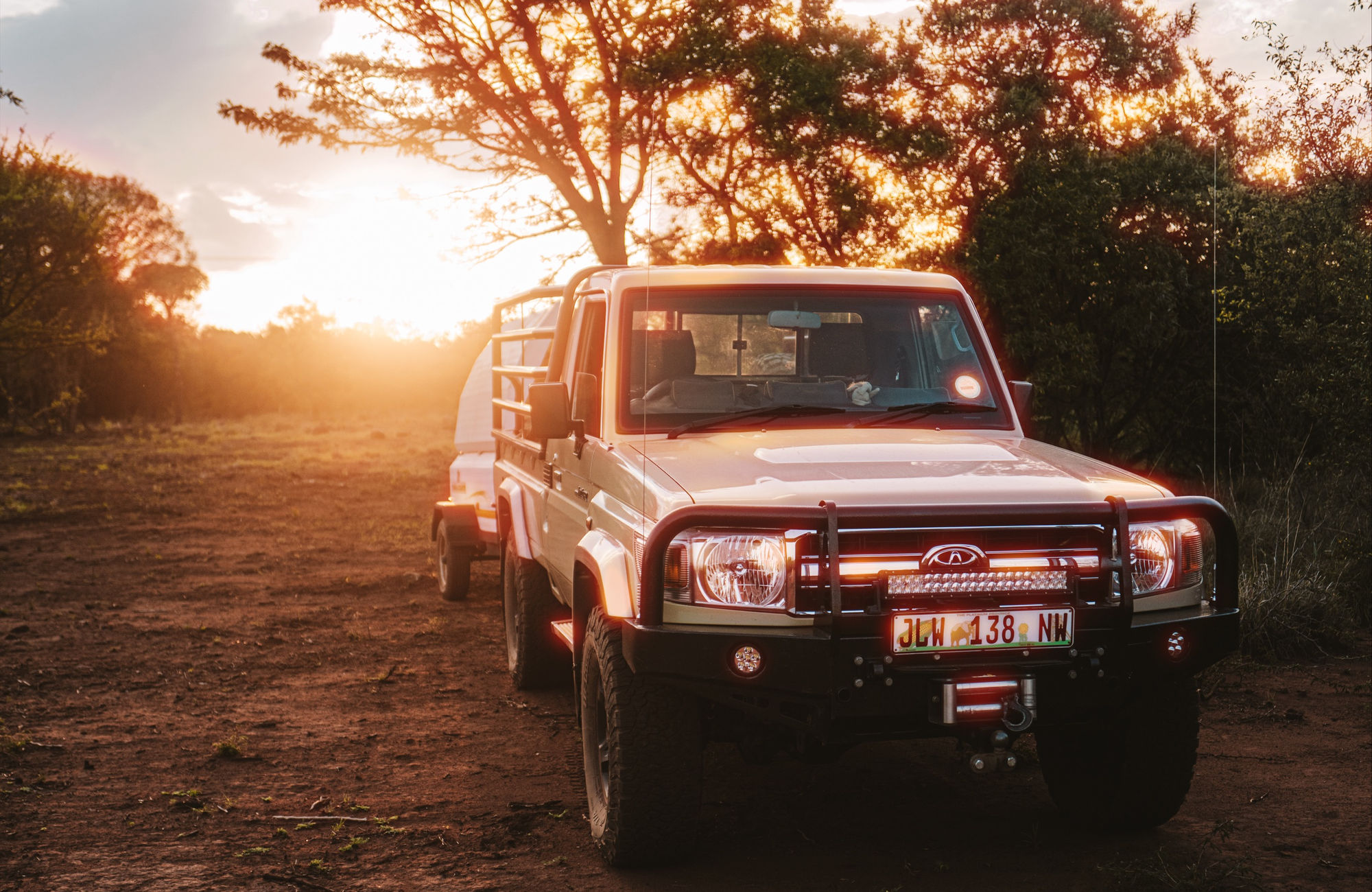 A field vehicle returning at sunset
