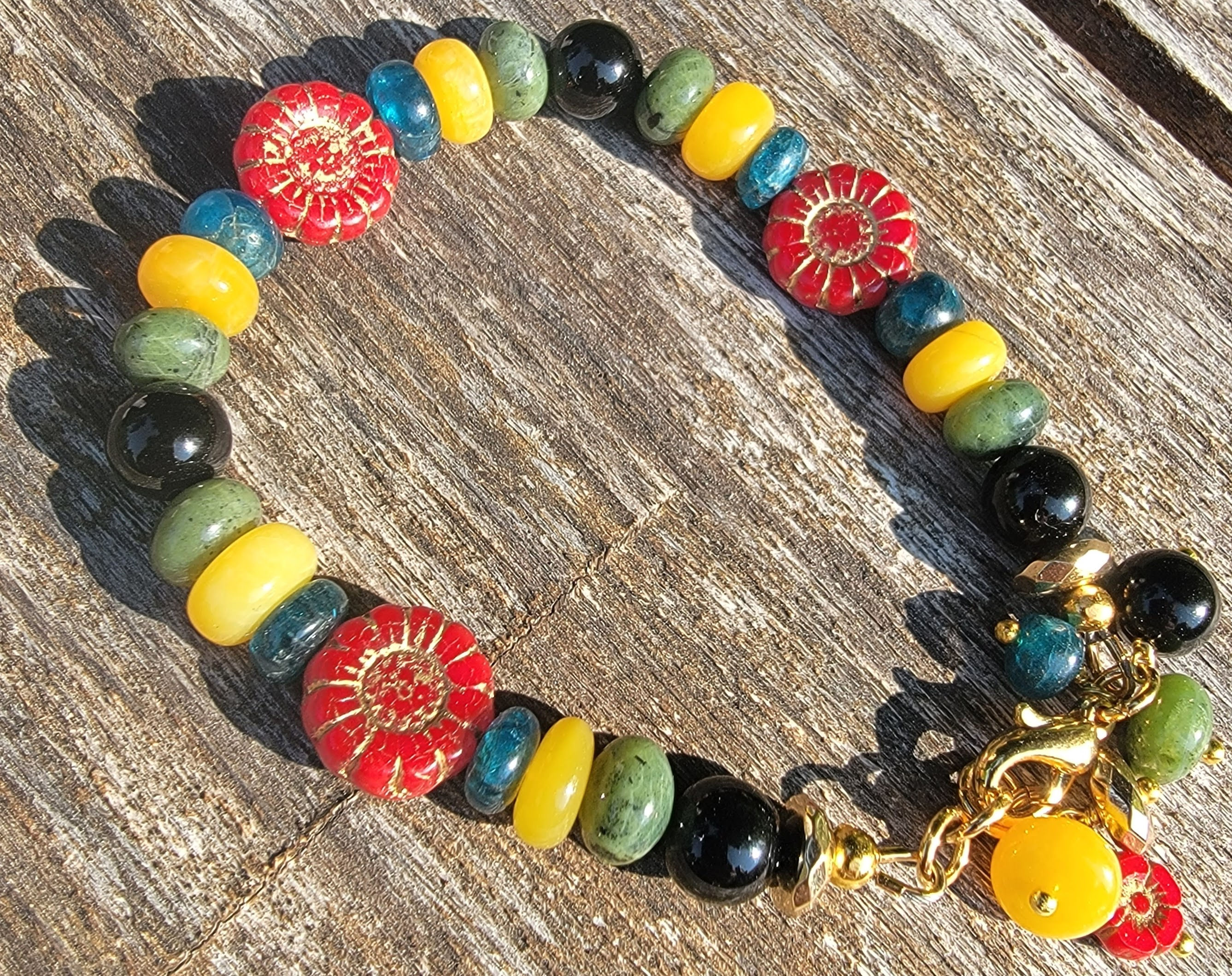 Blue apatite, green jade, onyx, red glass gold bracelet