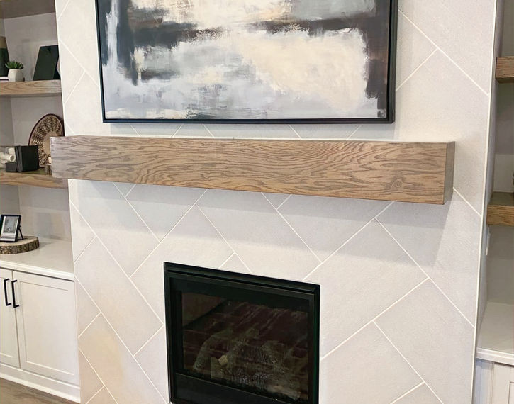 Custom trim work and mantle over installed fireplace